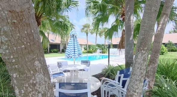 pool with a patio area