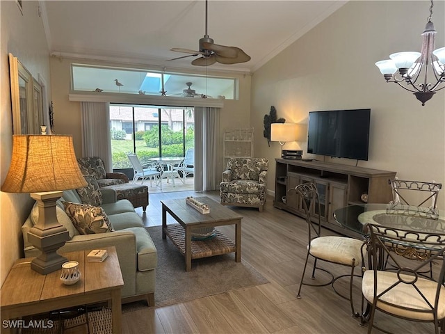 living area with high vaulted ceiling, crown molding, light wood-style flooring, and ceiling fan with notable chandelier