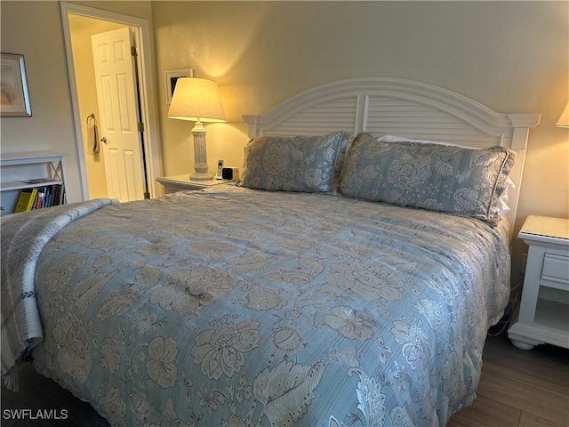 bedroom featuring dark wood-type flooring