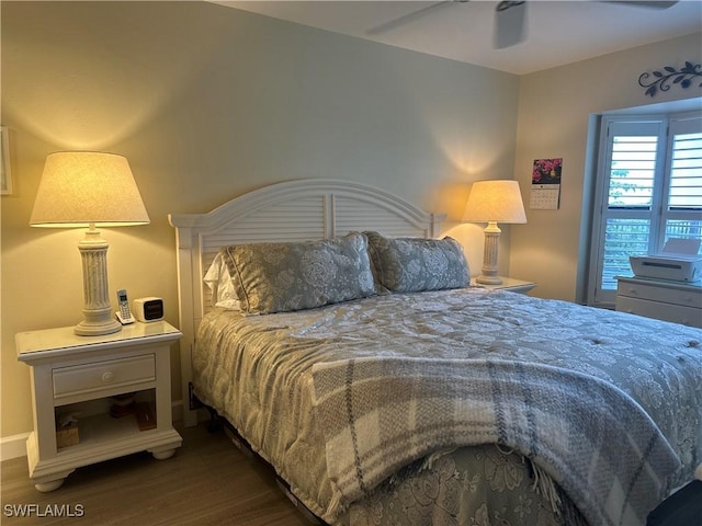 bedroom featuring dark wood finished floors