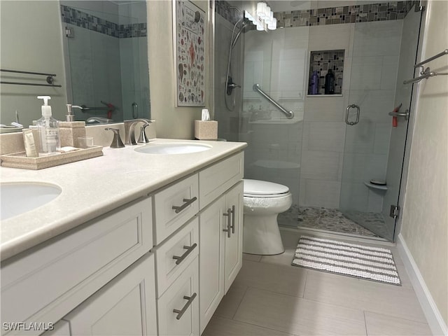 full bath featuring double vanity, a stall shower, toilet, tile patterned flooring, and a sink