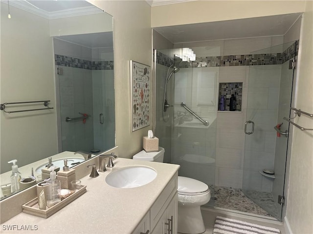 full bath with a stall shower, crown molding, vanity, and toilet