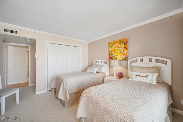 carpeted bedroom with baseboards, visible vents, a closet, and ornamental molding