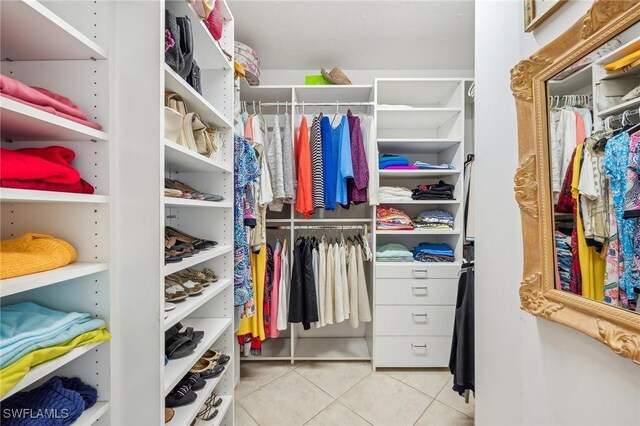 walk in closet featuring light tile patterned floors