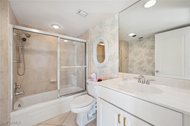 full bathroom with enclosed tub / shower combo, vanity, toilet, and tile patterned floors