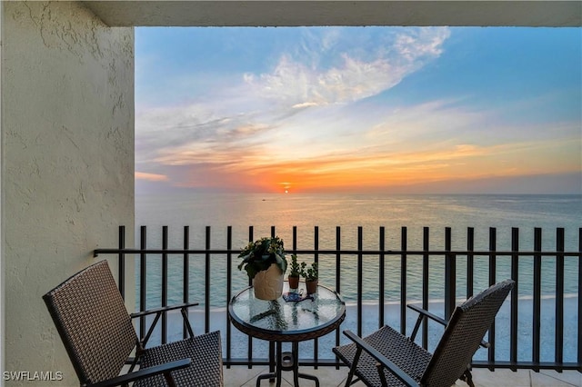 balcony featuring a water view