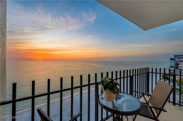 balcony at dusk with a water view