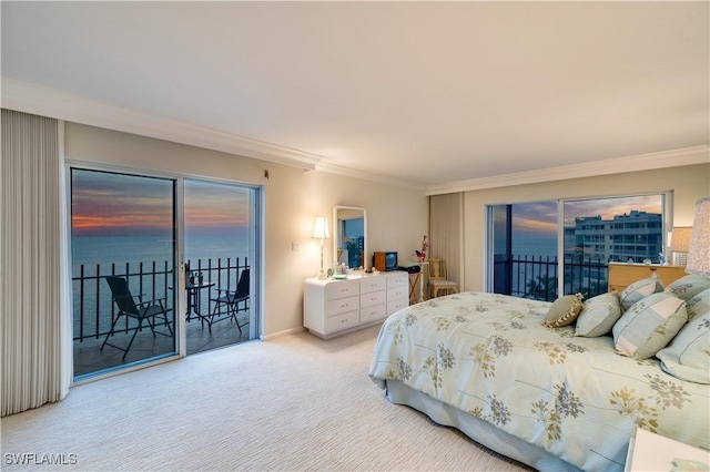 bedroom featuring a water view, ornamental molding, carpet floors, and access to outside