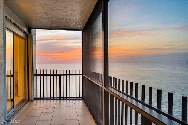 balcony at dusk with a water view