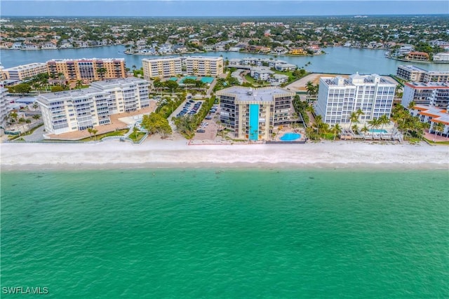 aerial view with a city view, a view of the beach, and a water view