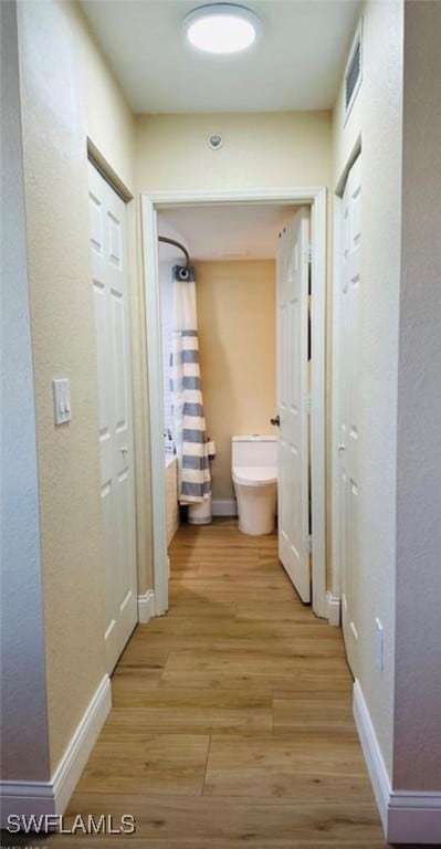 hallway featuring light wood-type flooring