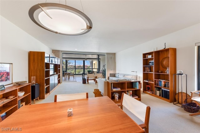 view of carpeted dining area