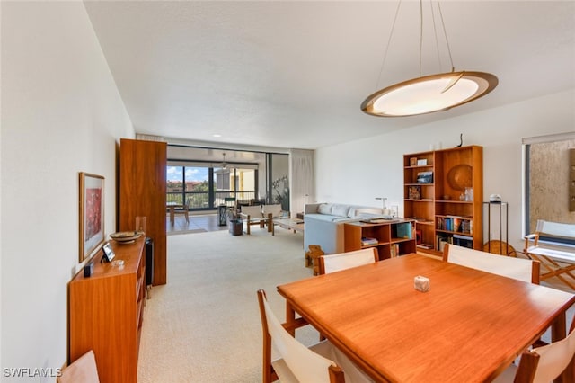 dining room with light colored carpet