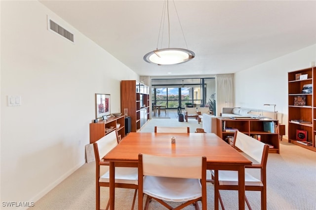 dining room featuring carpet