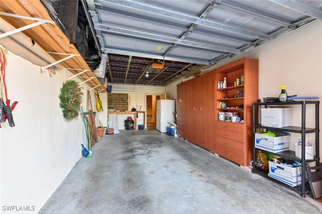 garage with white refrigerator