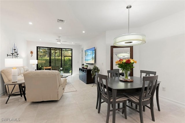 tiled dining room with ceiling fan