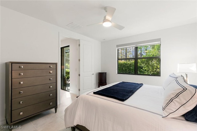 tiled bedroom with ceiling fan