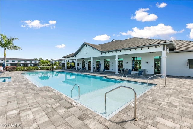 view of swimming pool with a patio area