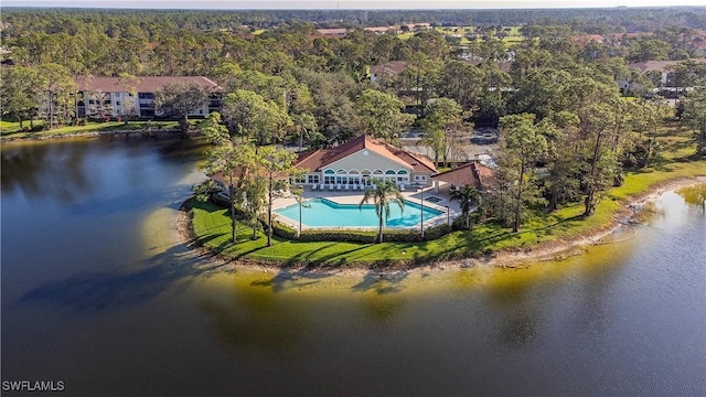 aerial view with a water view and a view of trees