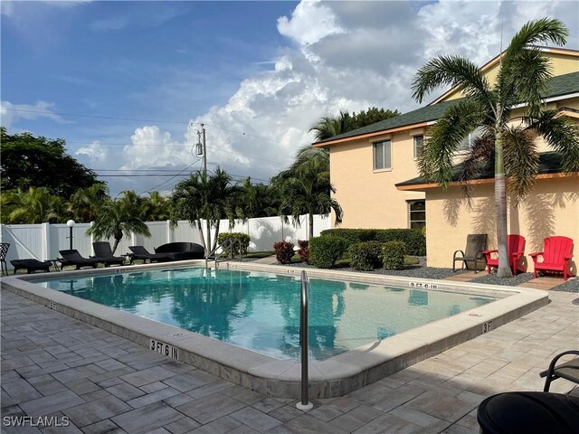 view of swimming pool featuring a patio