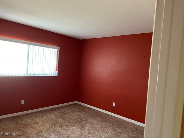 unfurnished room featuring carpet flooring