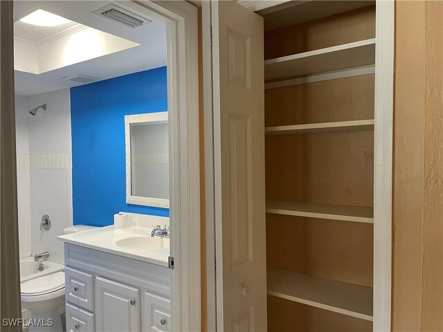 full bathroom featuring vanity, toilet, and bathtub / shower combination