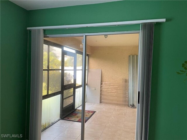 doorway featuring light tile patterned floors