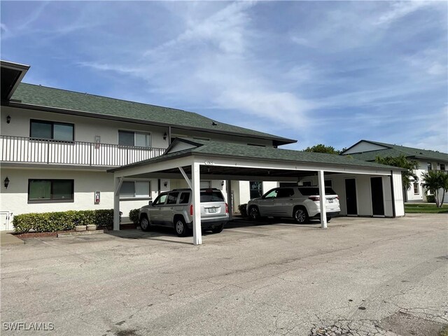 view of car parking featuring a carport