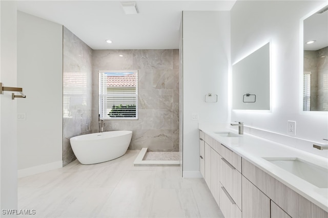 bathroom with plus walk in shower and vanity