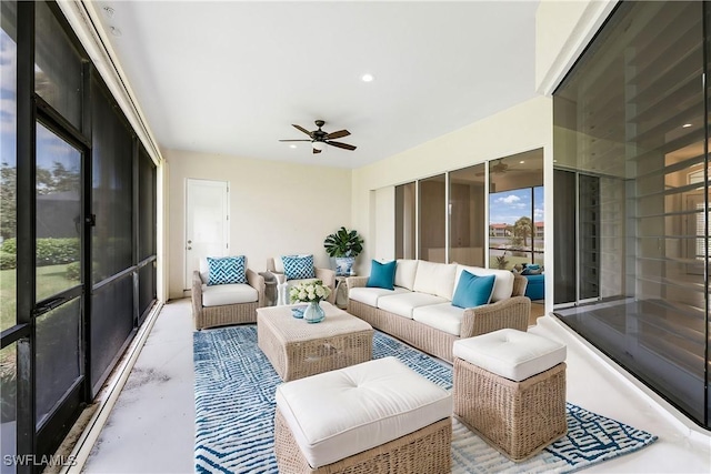 sunroom featuring ceiling fan