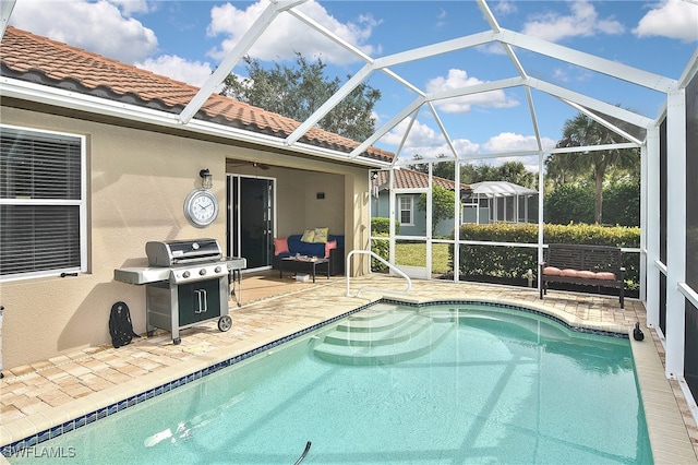 view of pool featuring a lanai, a patio, and area for grilling