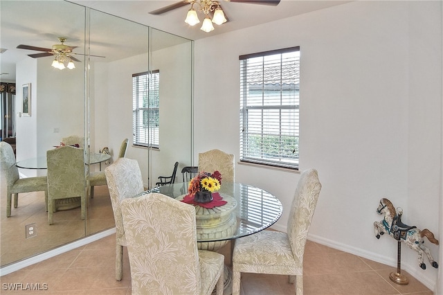 dining space with ceiling fan and light tile patterned floors