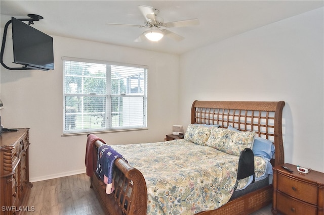 bedroom featuring dark wood-type flooring and ceiling fan