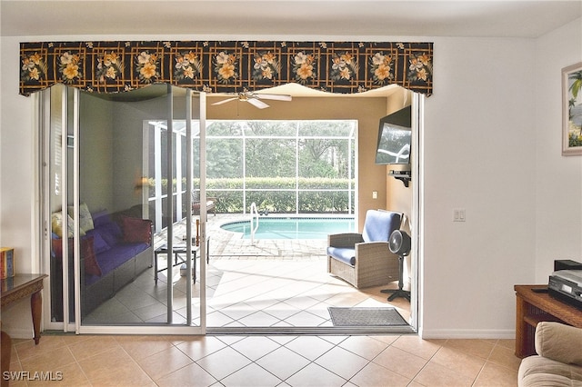 entryway with tile patterned flooring and ceiling fan