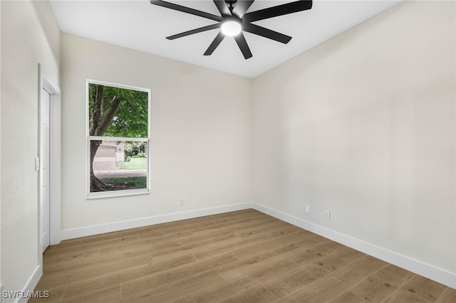 spare room featuring light hardwood / wood-style flooring and ceiling fan