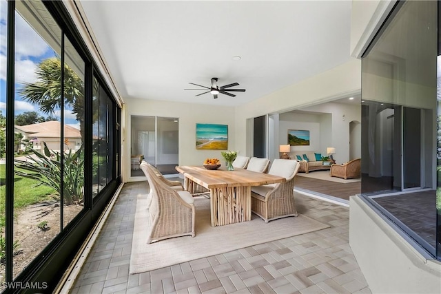 sunroom with ceiling fan