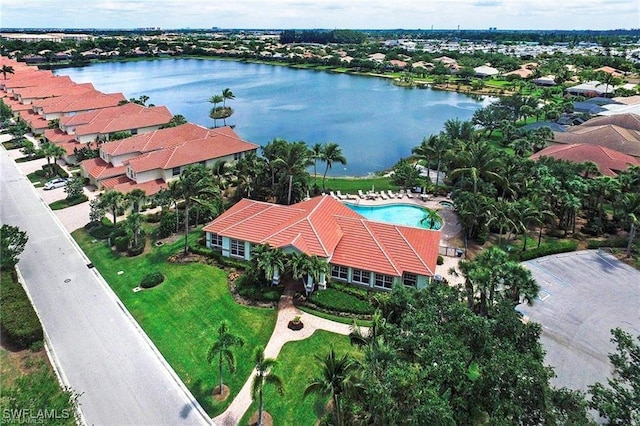 birds eye view of property with a water view