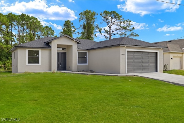 single story home with a garage and a front lawn