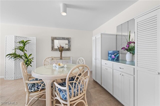 dining area featuring light tile patterned floors