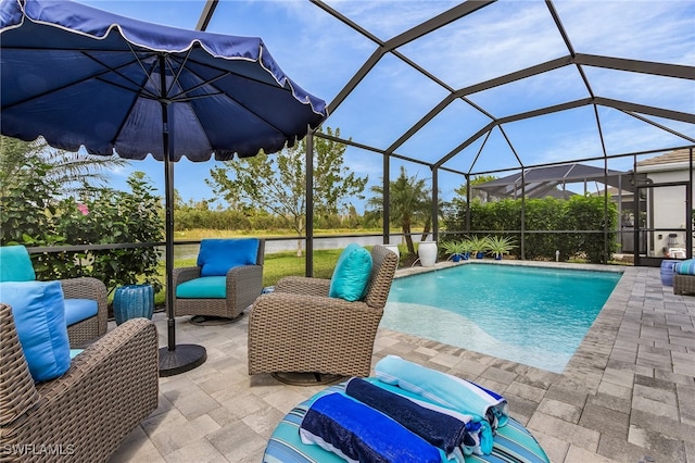 outdoor pool featuring a patio area and a lanai