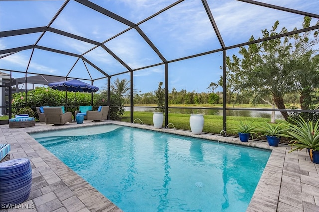 pool with a water view, a patio area, a lanai, and an outdoor hangout area