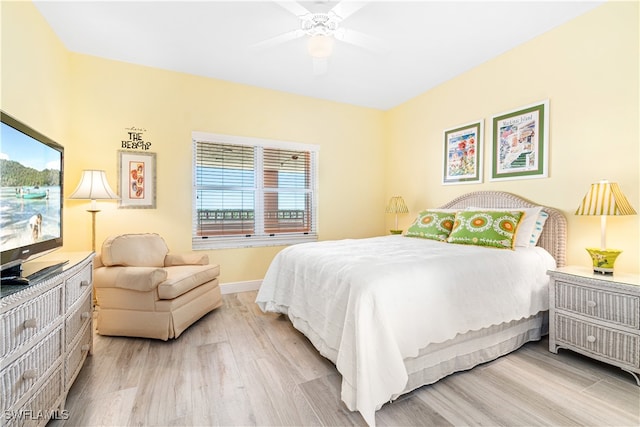 bedroom featuring light wood-type flooring and ceiling fan