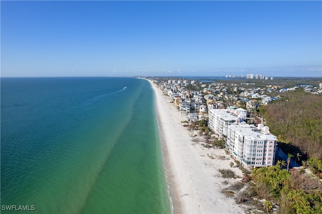 birds eye view of property with a beach view and a water view