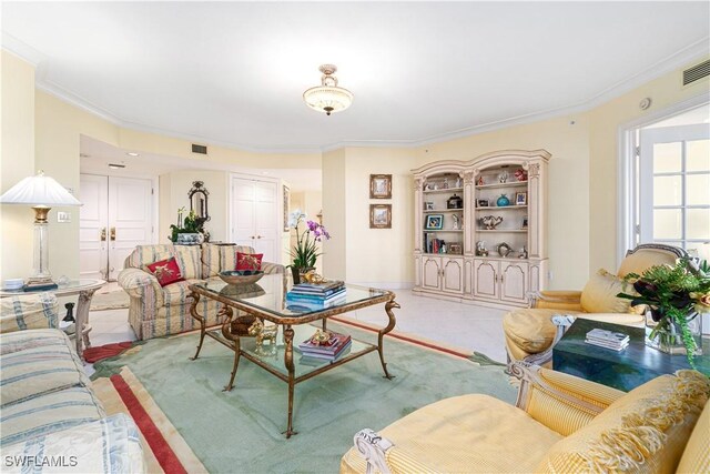 living room featuring crown molding