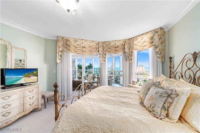 carpeted bedroom featuring crown molding