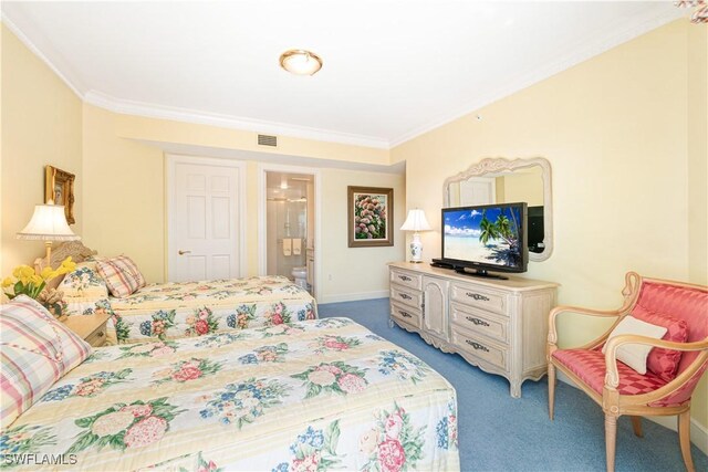 carpeted bedroom with crown molding and ensuite bathroom