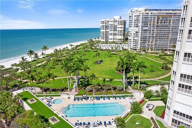 bird's eye view featuring a view of the beach and a water view