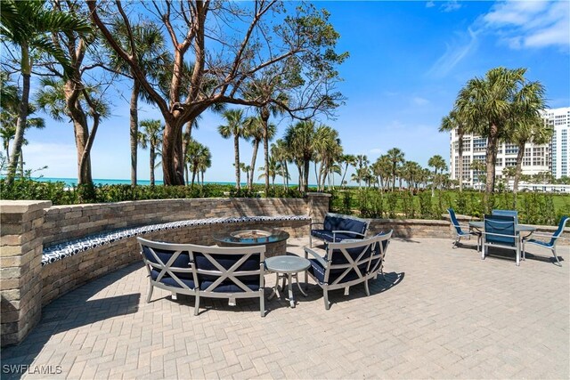 view of patio with an outdoor fire pit