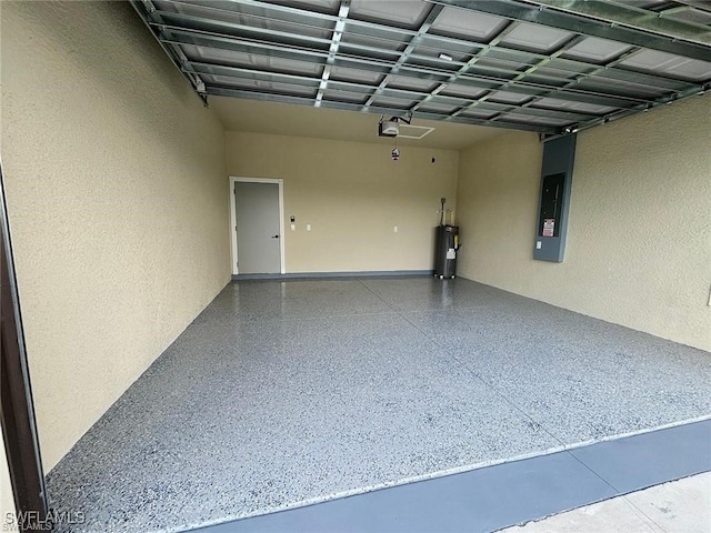 garage featuring water heater and electric panel