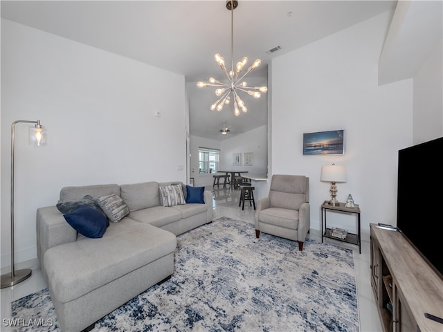 living room with lofted ceiling, an inviting chandelier, and light tile patterned floors